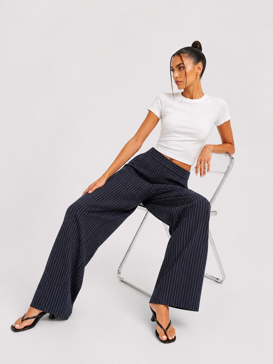 Pantalones plisados a rayas