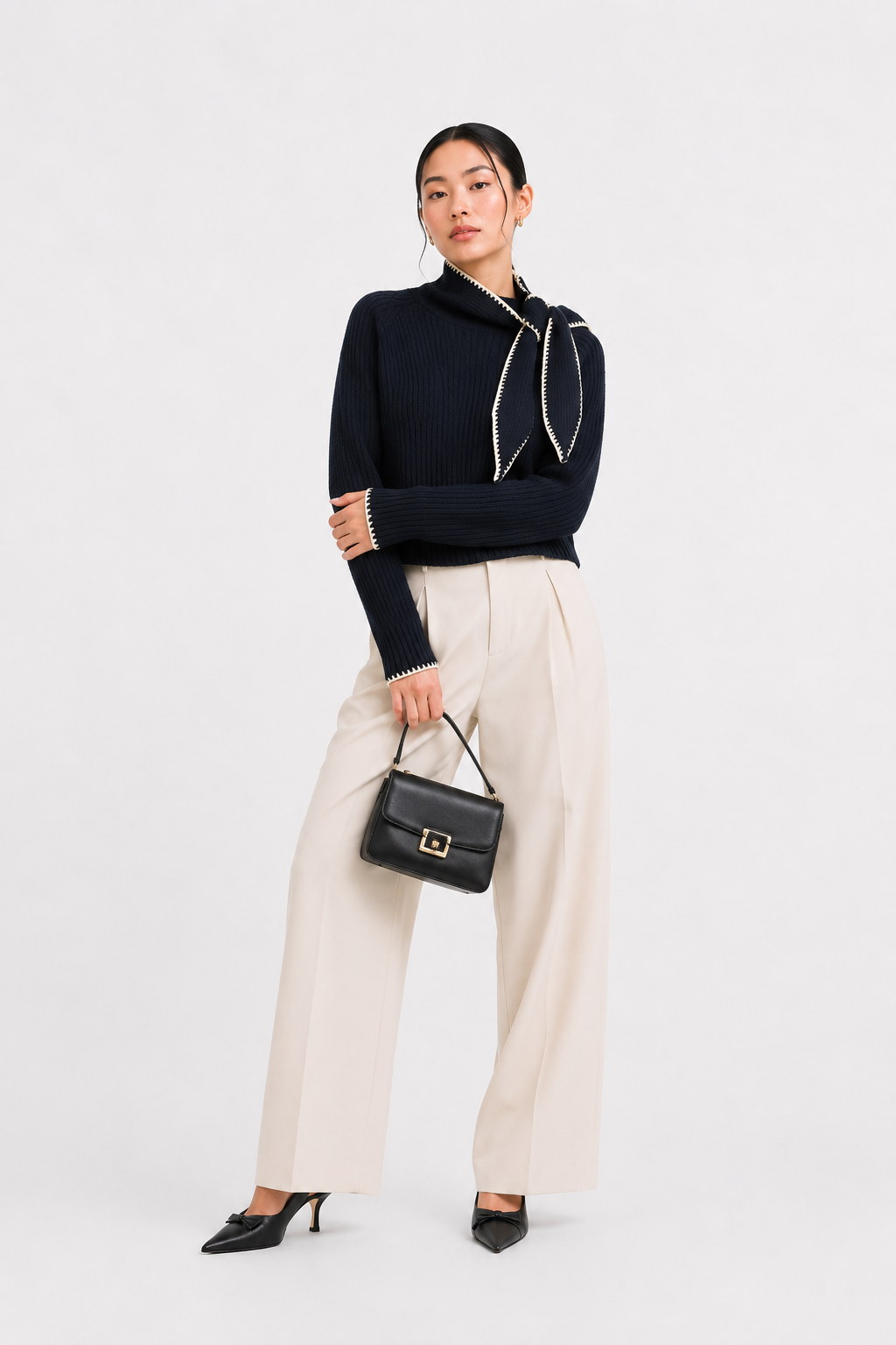 Knitted jumper with bow