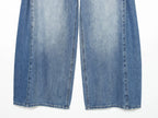 Jeans con pliegues laterales