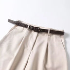 Shorts de tiro alto con pliegues y cinturón