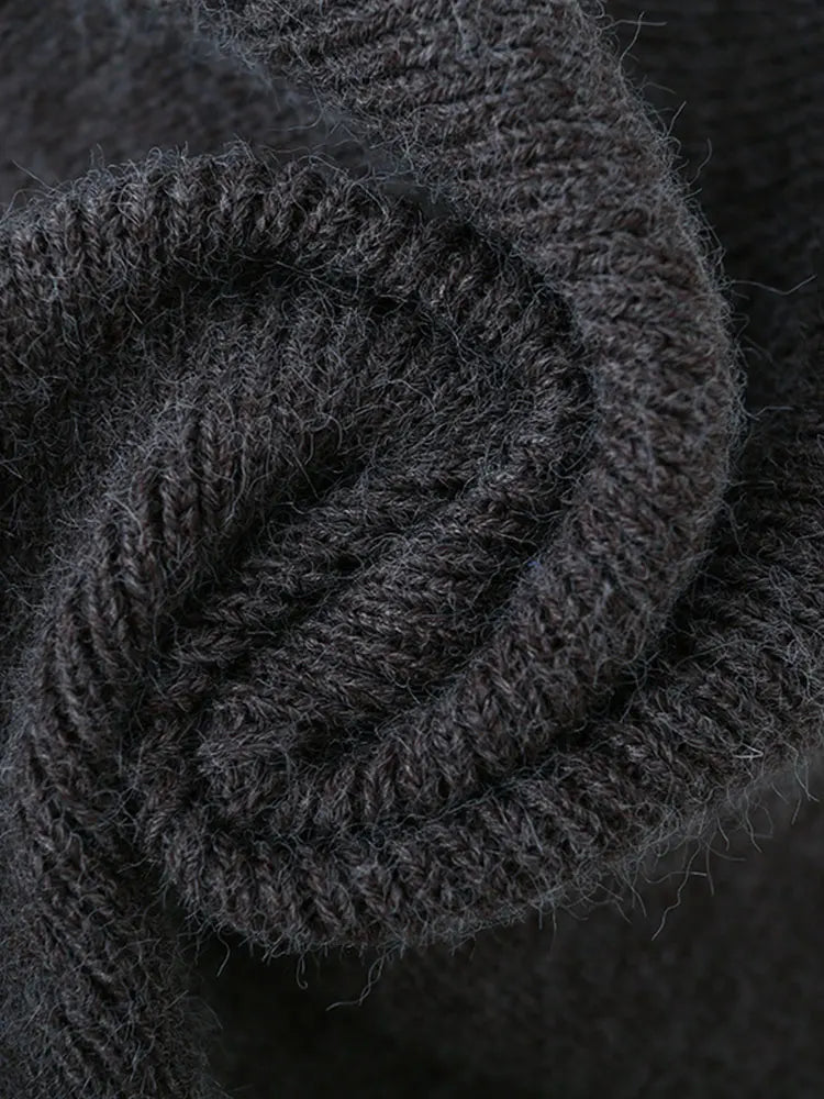 Suéter de punto suelto cuello vuelto