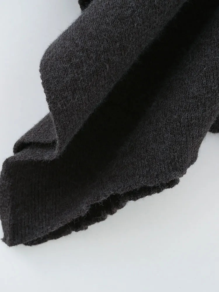 Suéter de punto suelto cuello vuelto