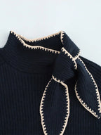 Knitted jumper with bow