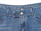 Jeans con pliegues laterales